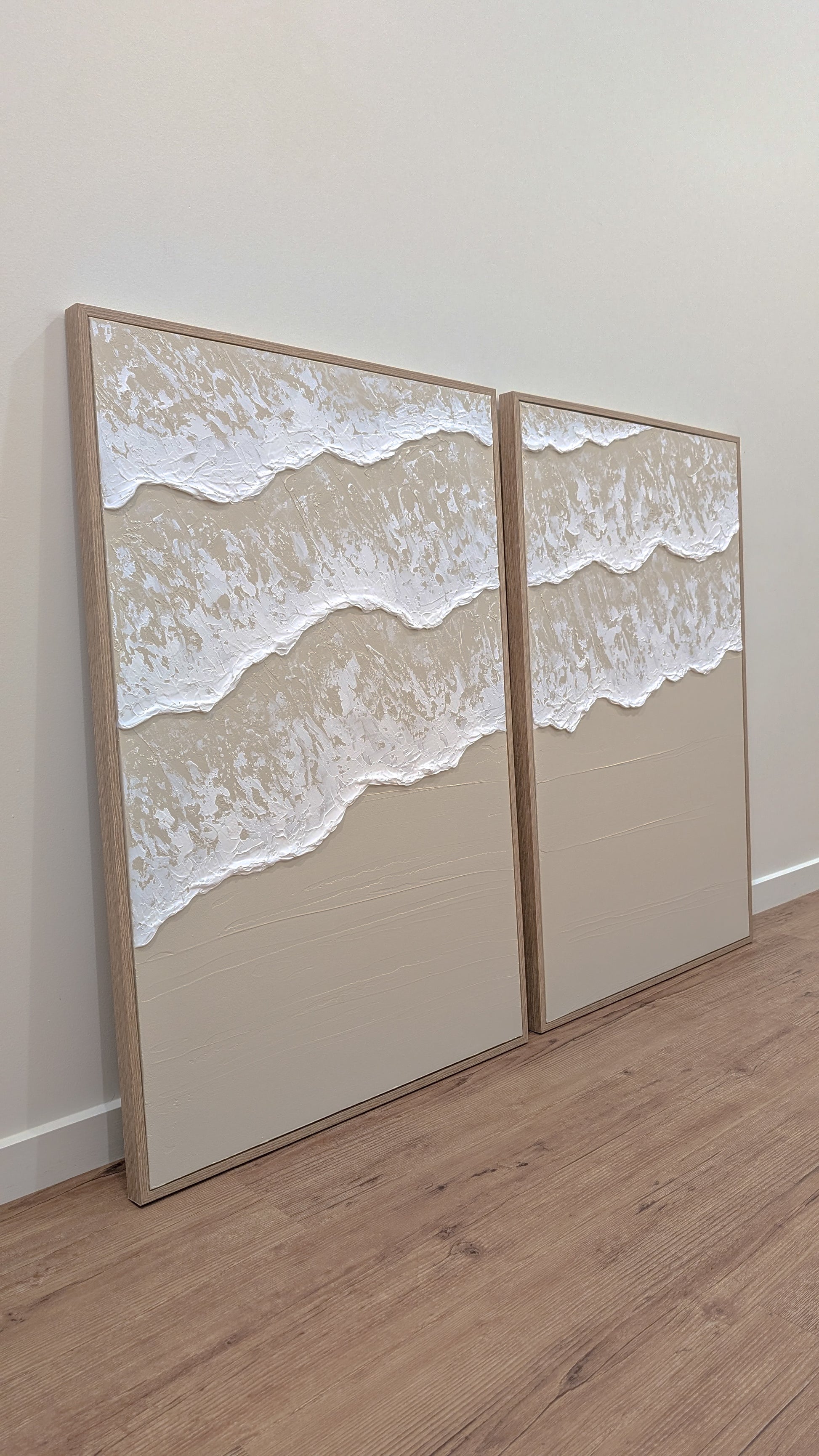 2 piece set of artwork framed in wood, white Ocean waves on beige neutral textured background