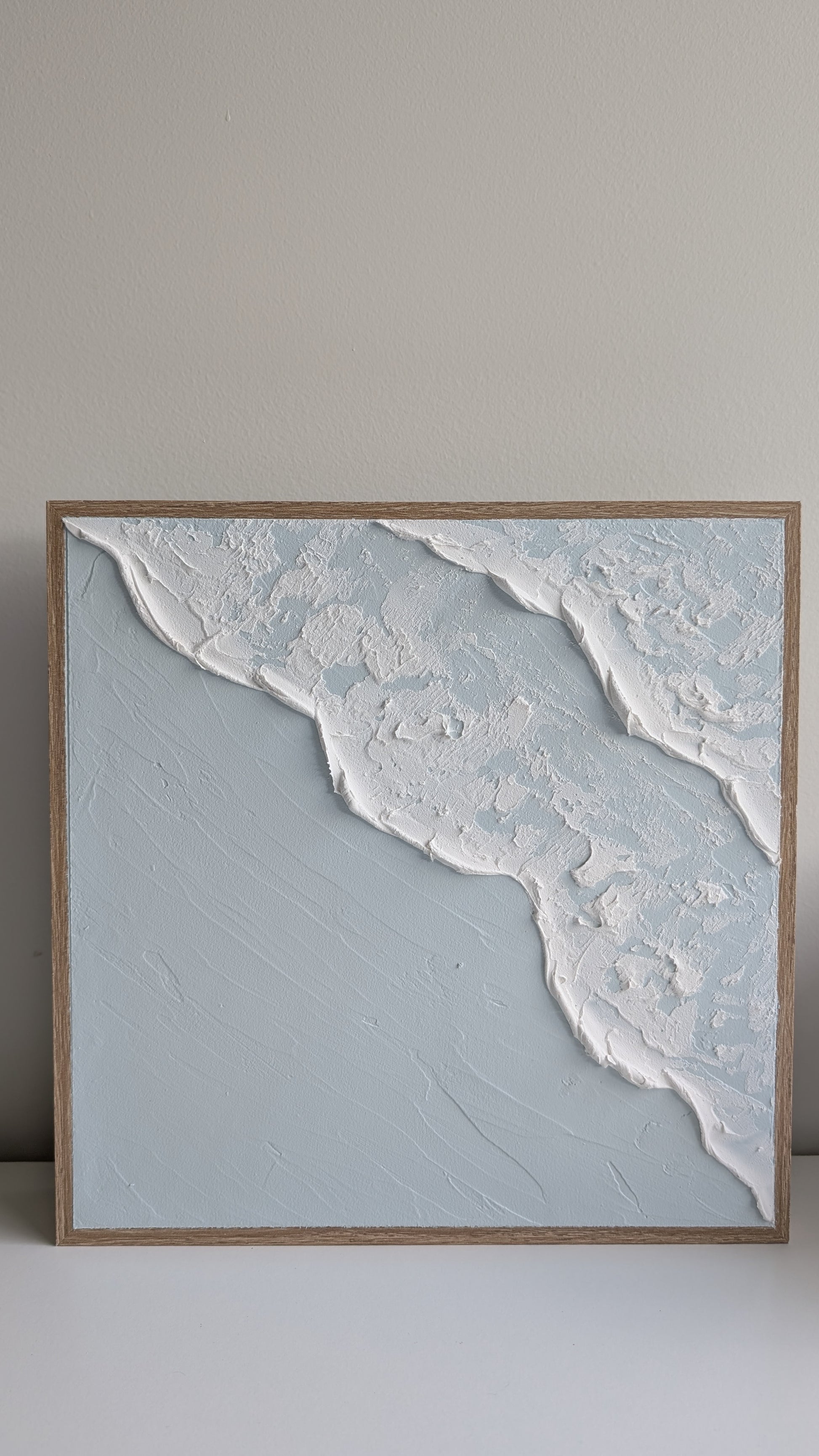 Beach wave textured painting framed in timber, close-up showing 3D wave detail