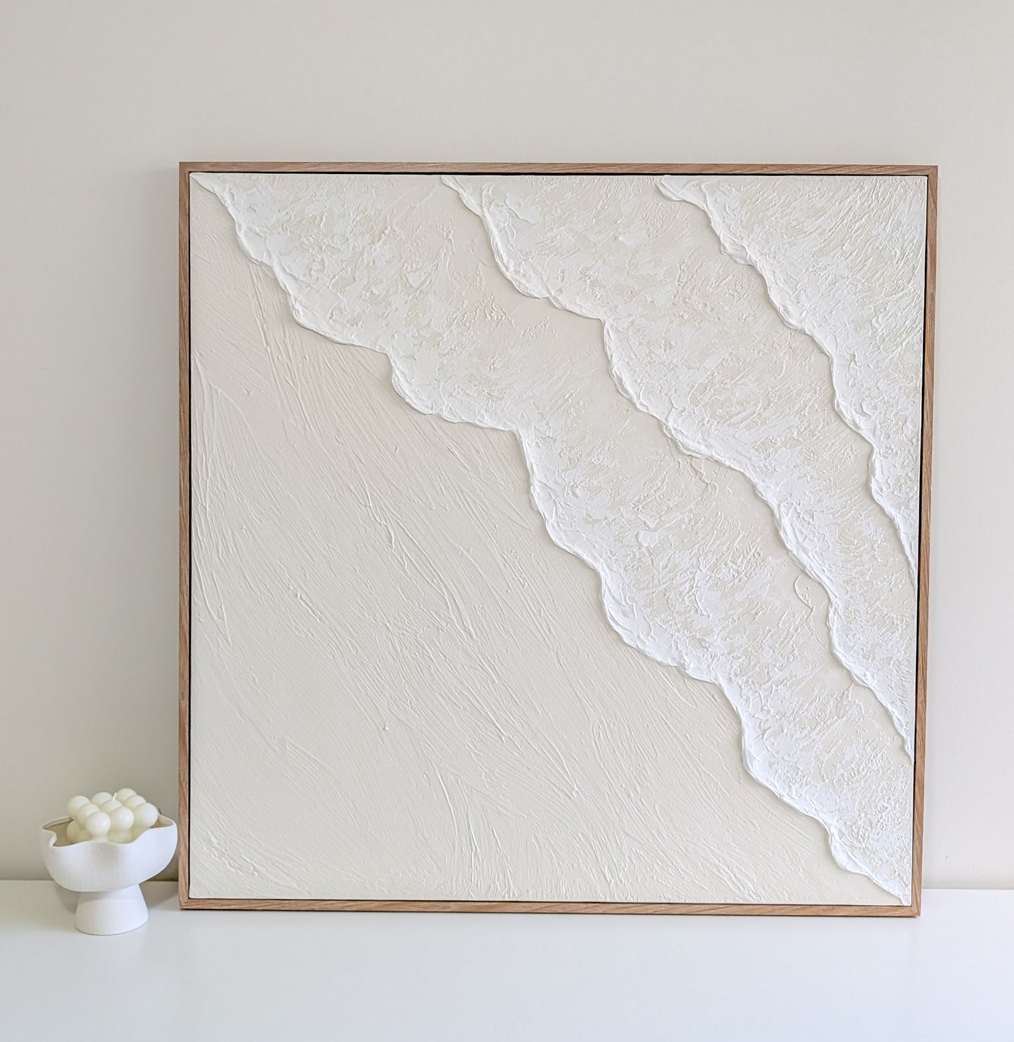 Ocean Wave Framed abstract artwork with white textured design on a light gray background